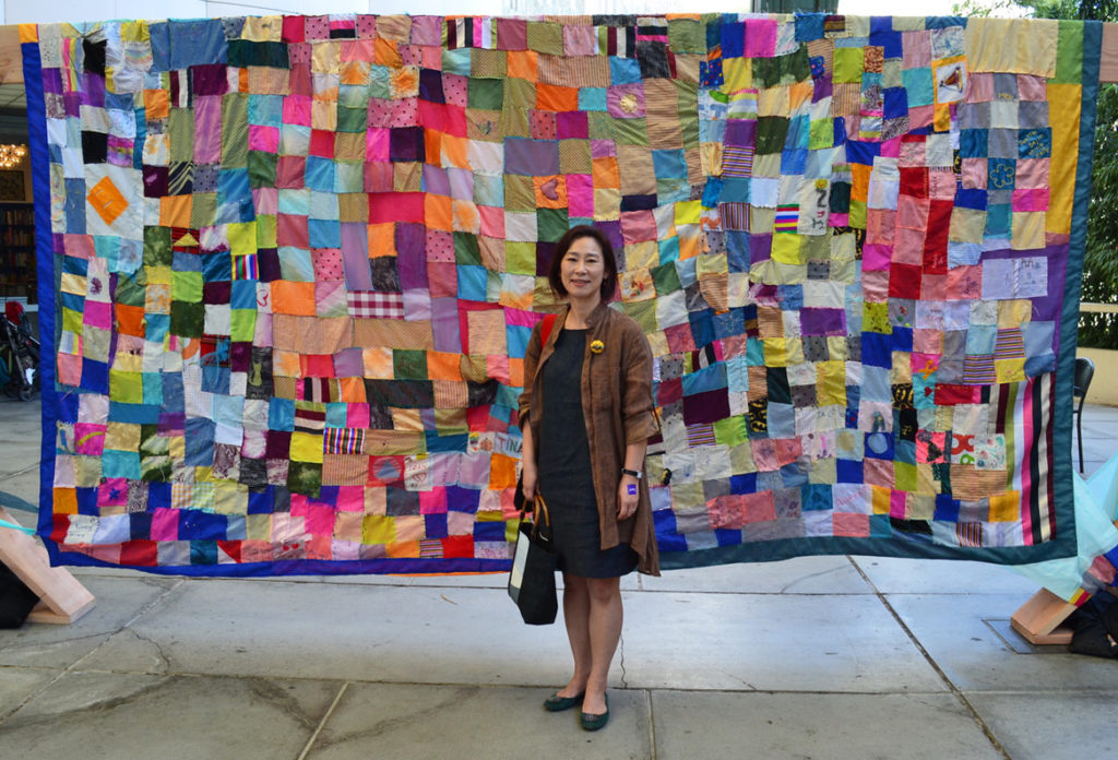 Youngmin Lee with community bojagi at LACMA Boone Children's Gallery